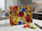 Glass cutting board with colorful floral design on marble countertop.
