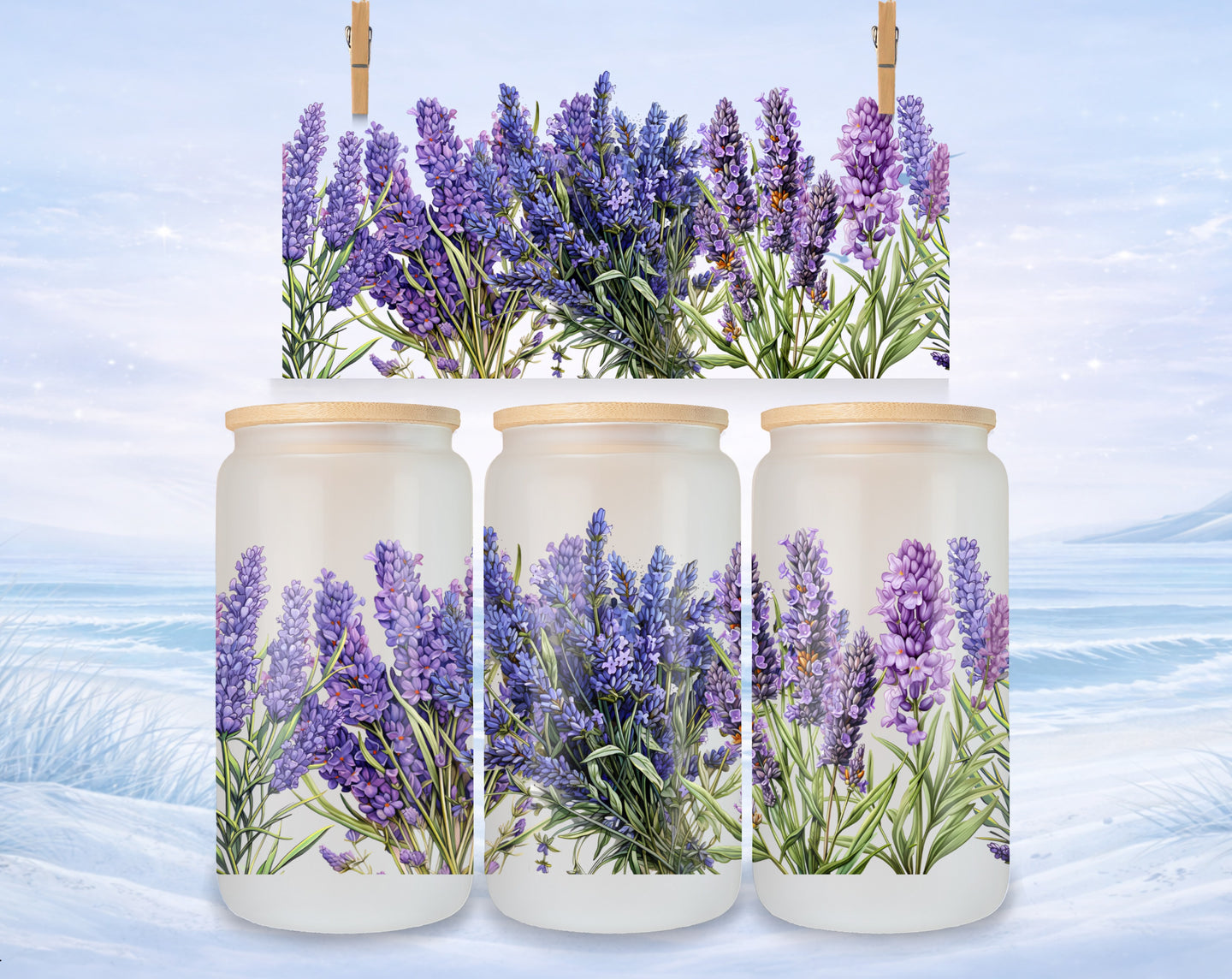 Three frosted glass jars with lavender sprigs, hanging against a winter landscape.
