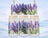Three frosted glass jars with lavender sprigs, hanging against a winter landscape.