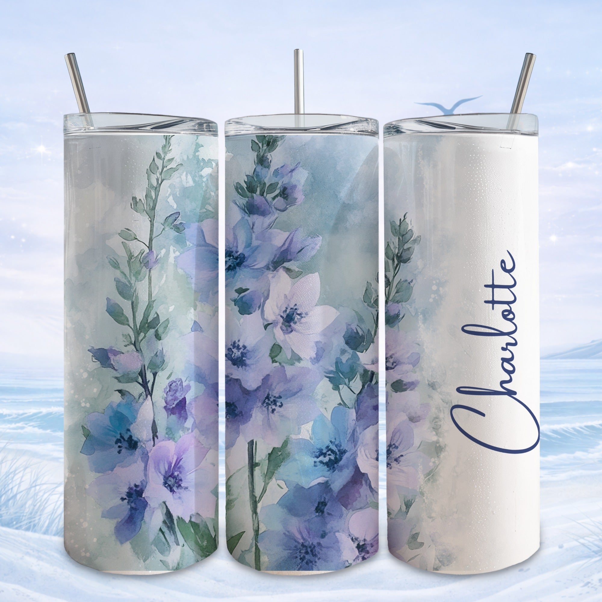 Three tumblers with blue floral watercolor design and "Charlotte" text.