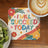 Coaster with colorful floral design and text "I WILL SUCCEED TODAY".