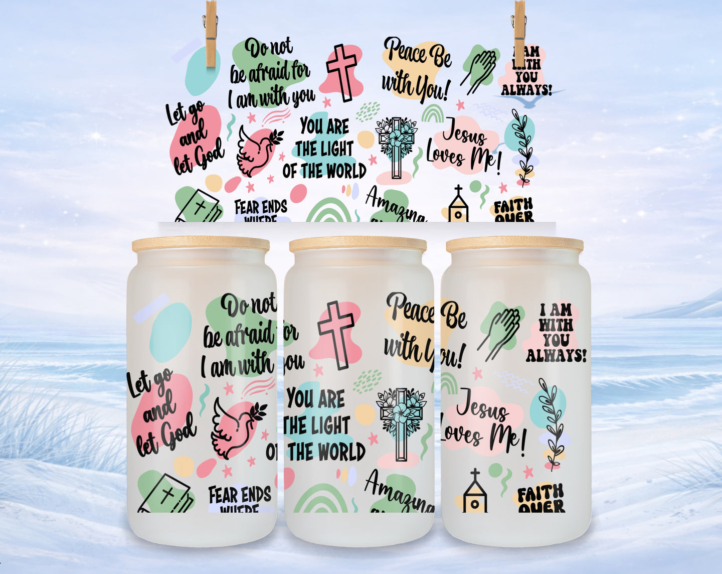 Three glass tumblers decorated with religious quotes and artwork.