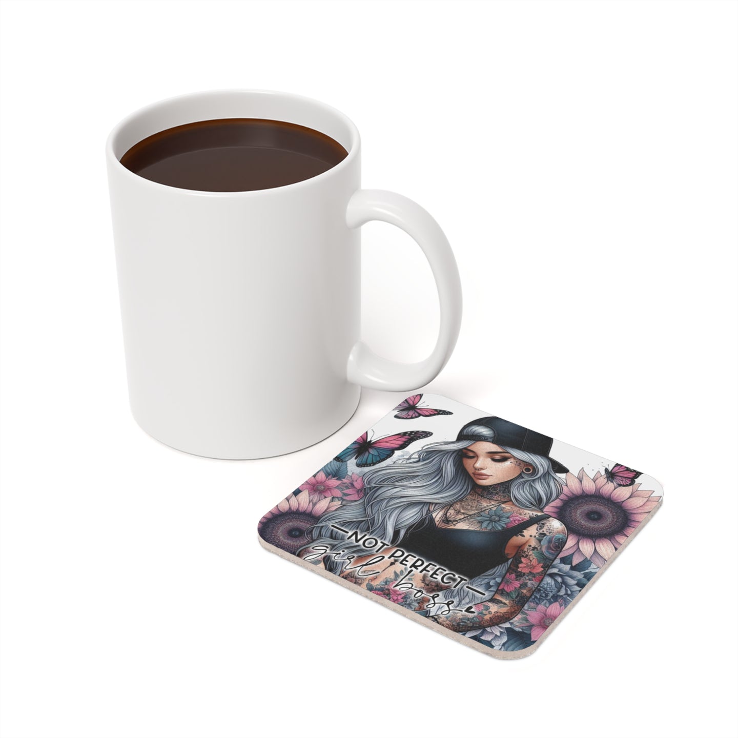 White mug and coaster with skull, sunflowers, and "Not Perfect, Just Real" text.
