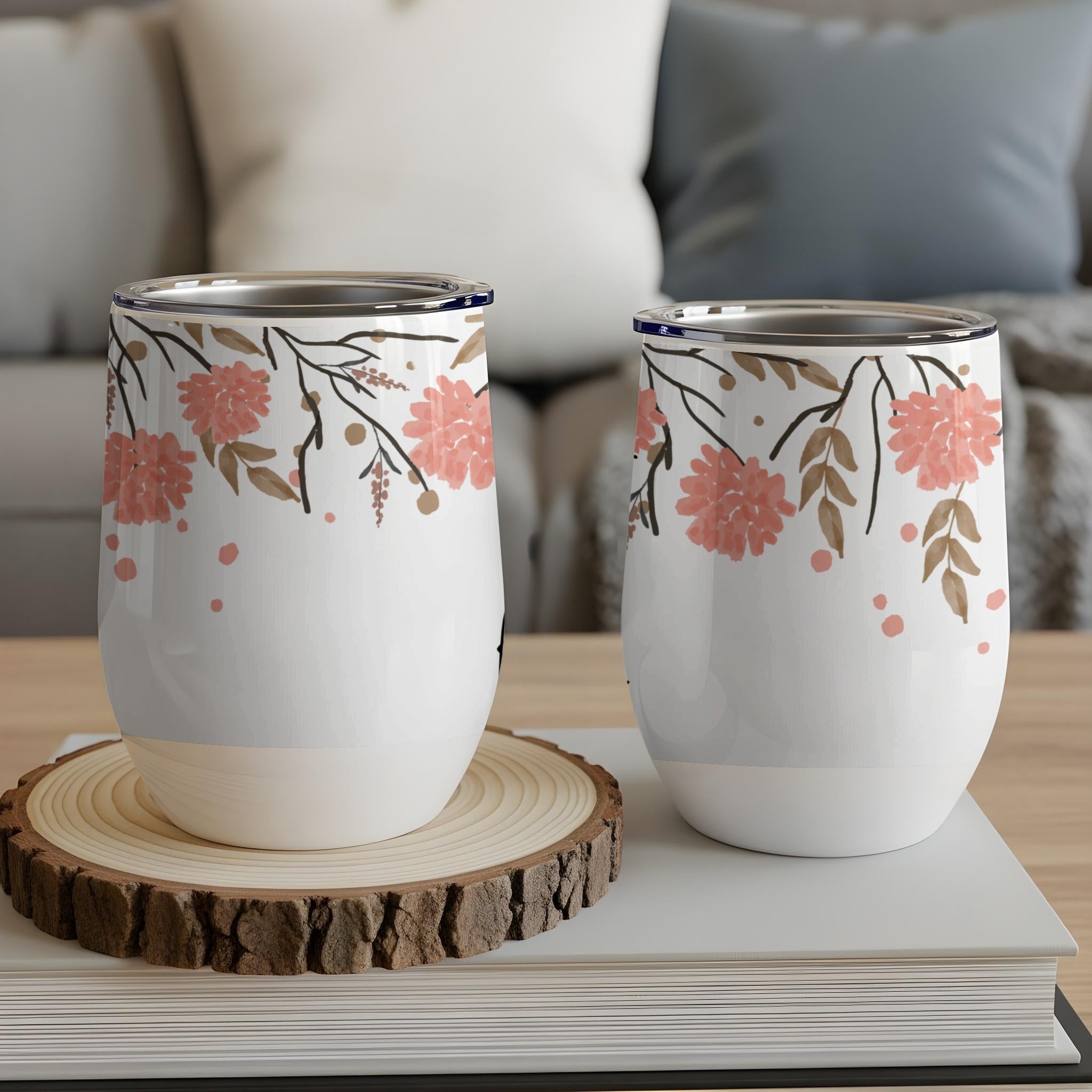 Two white tumblers with coral floral and branch pattern.