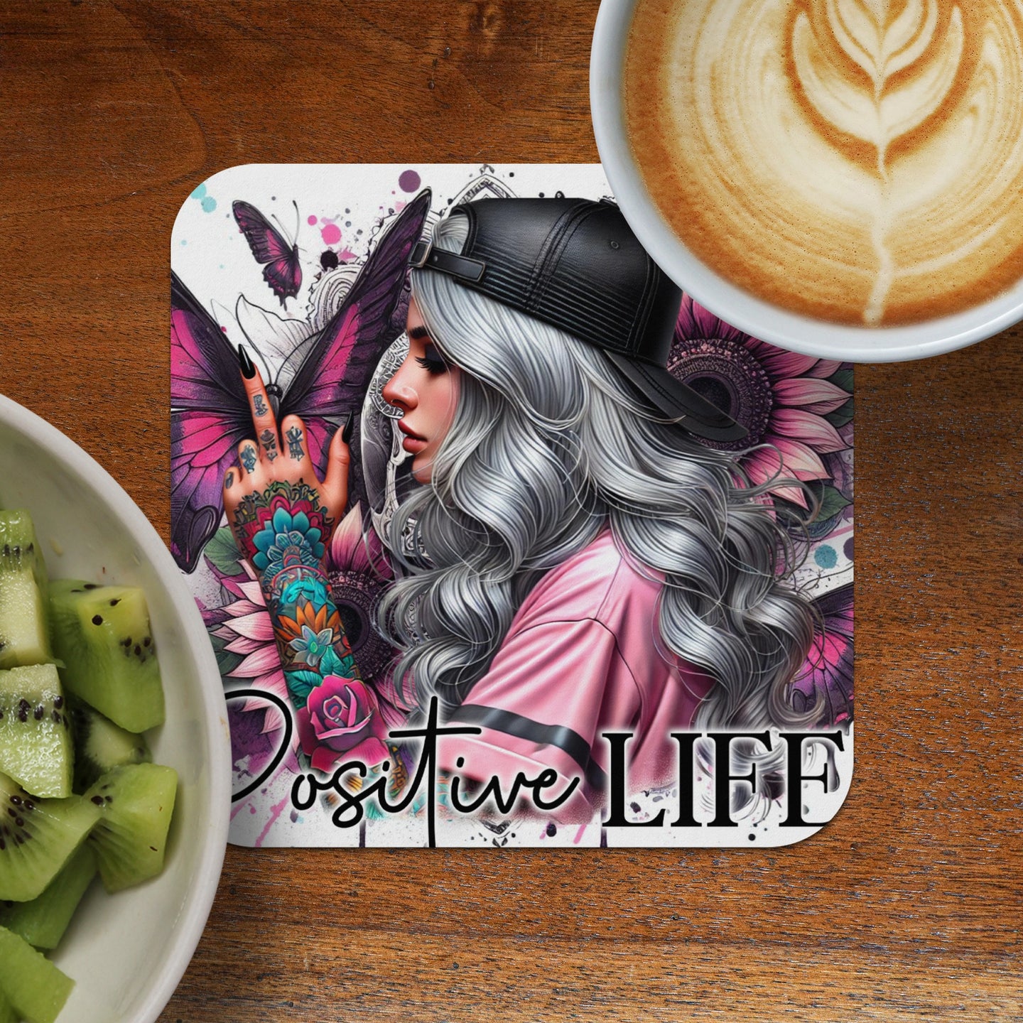 Woman with butterfly tattoo and pink shirt, text "POSITIVE LIFE"