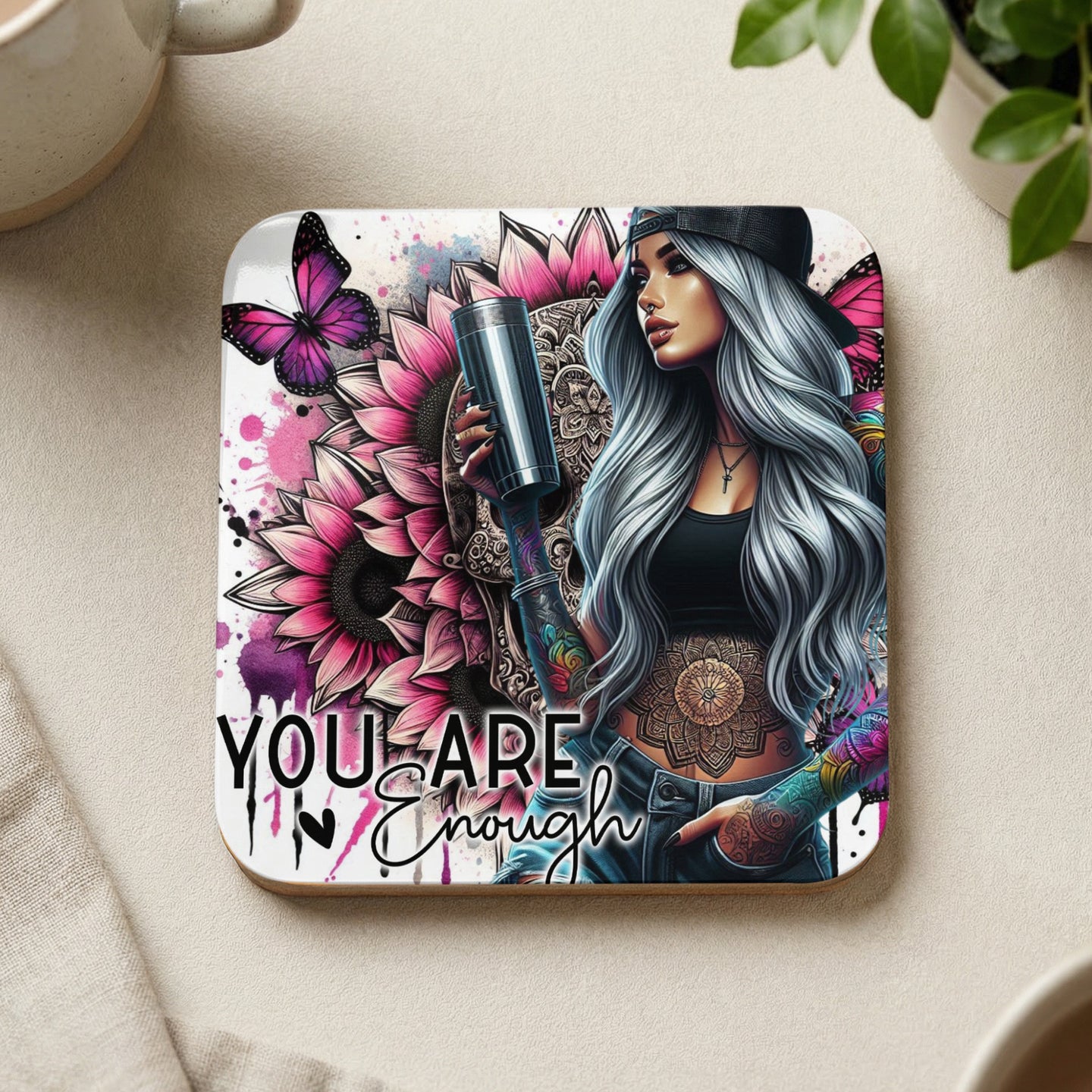 Tattooed woman with pink sunflowers and butterflies, text "YOU ARE ENOUGH".