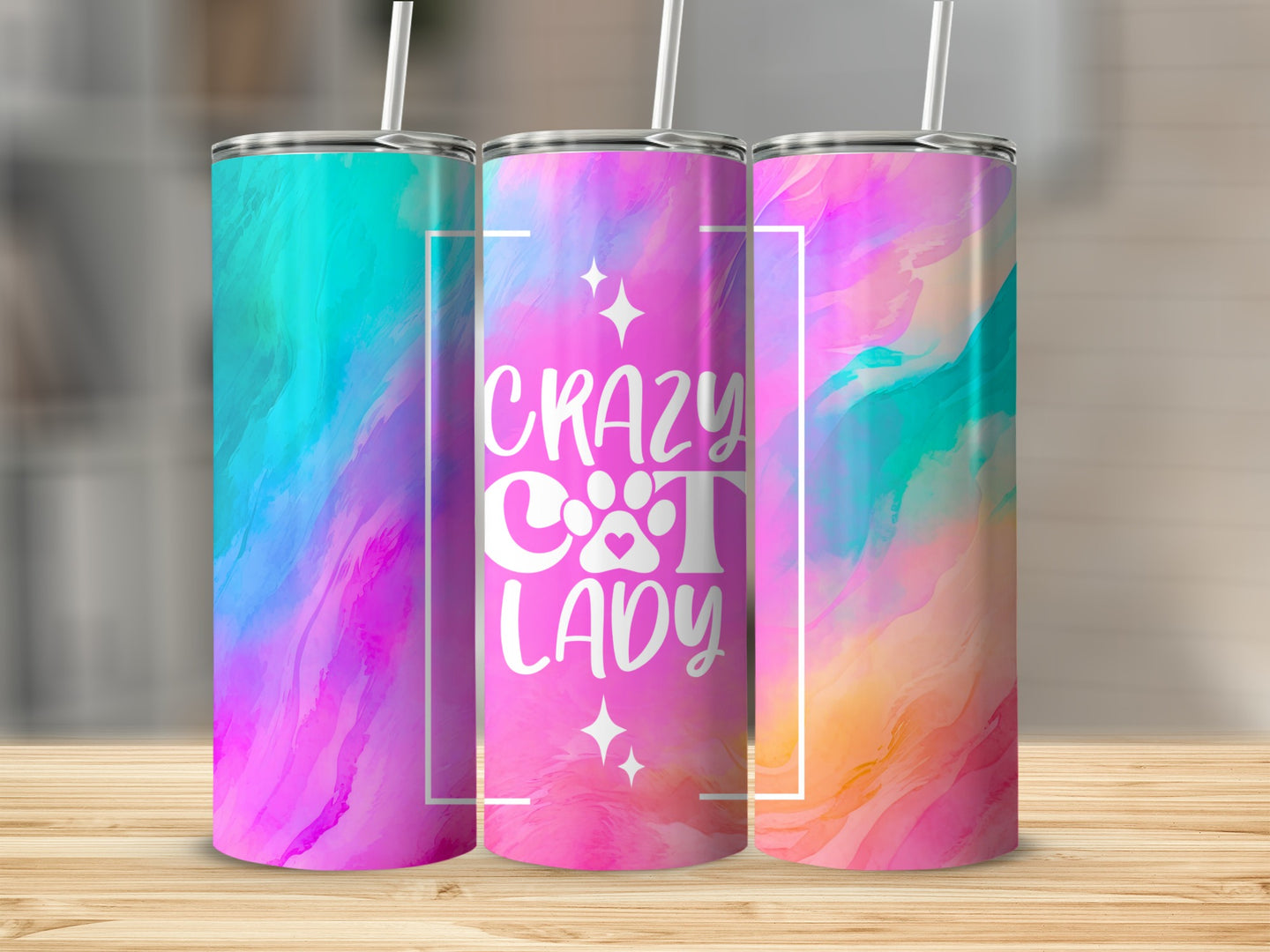 Three colorful tumblers with "Crazy Cat Lady" text and cat paw print.