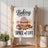 Kitchen towel with cupcake, cinnamon sticks, and "Baking is the spice of life" text.