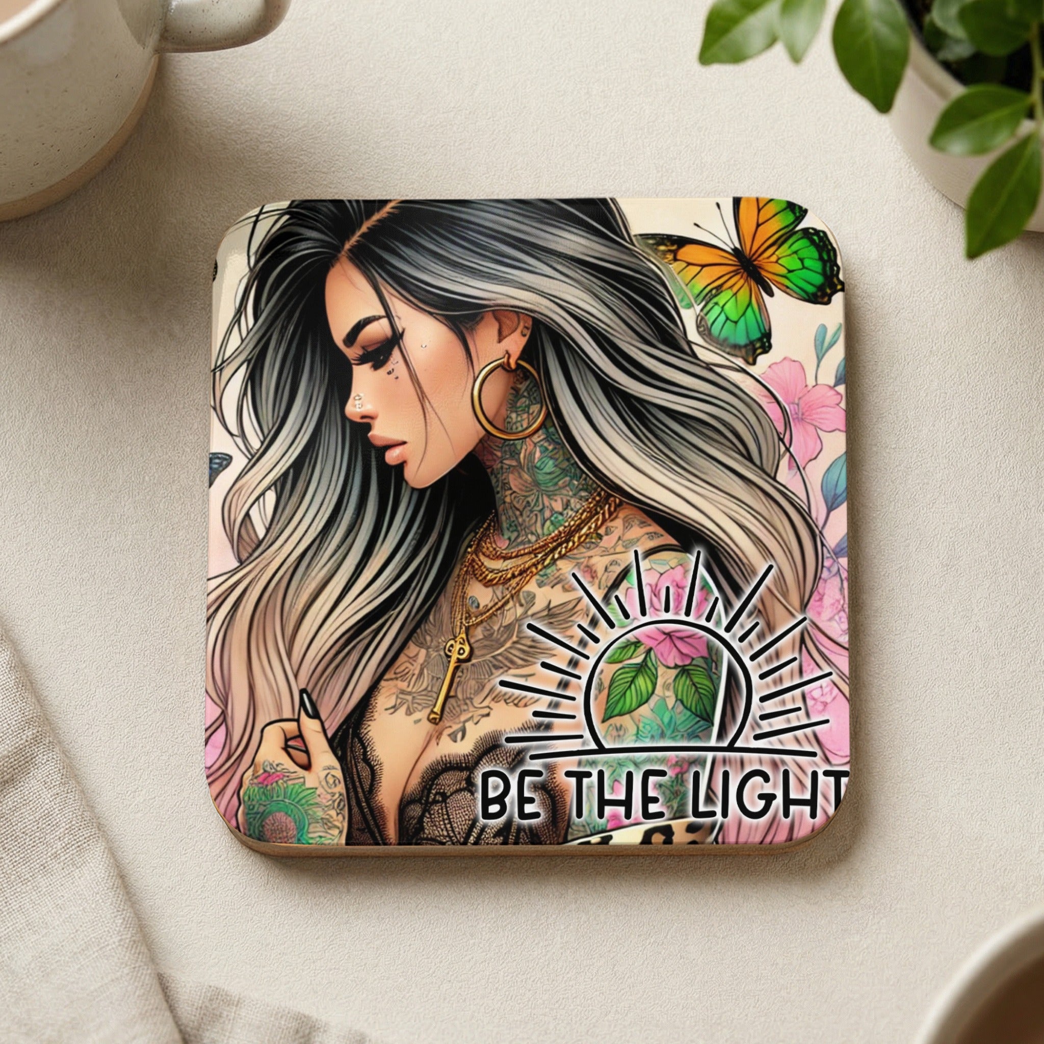 Tattooed woman with butterfly and floral design, "BE THE LIGHT" text.