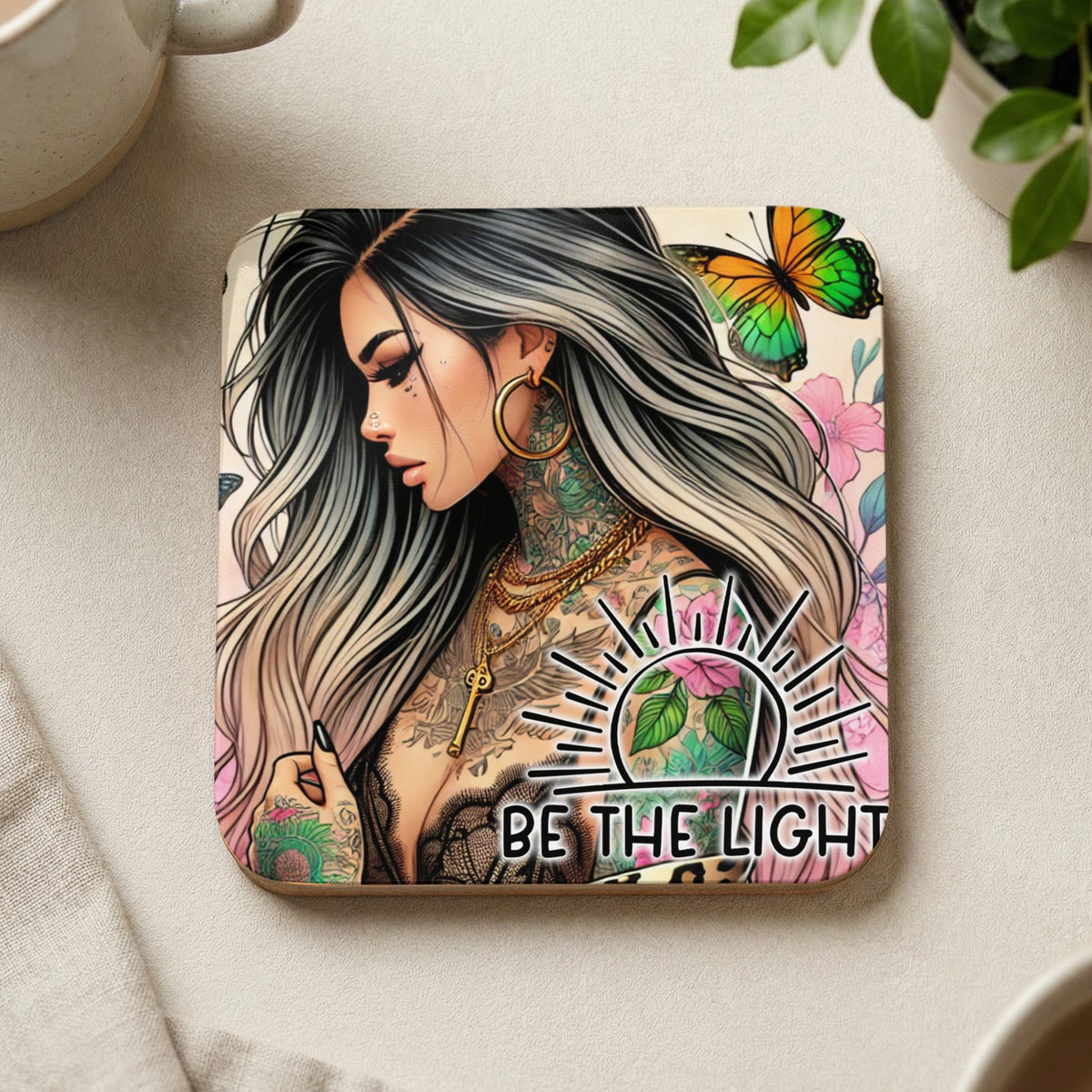 Tattooed woman with butterfly and floral design, "BE THE LIGHT" text.
