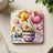 Floral coaster with tulips, a purple polka dot pot, and "be kind always" text.