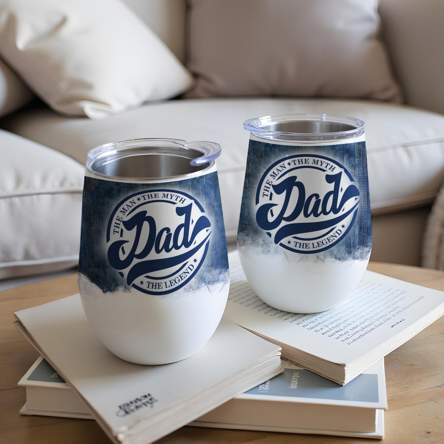 Two white stemless wine tumblers with denim and "Dad The Man The Myth The Legend" text.