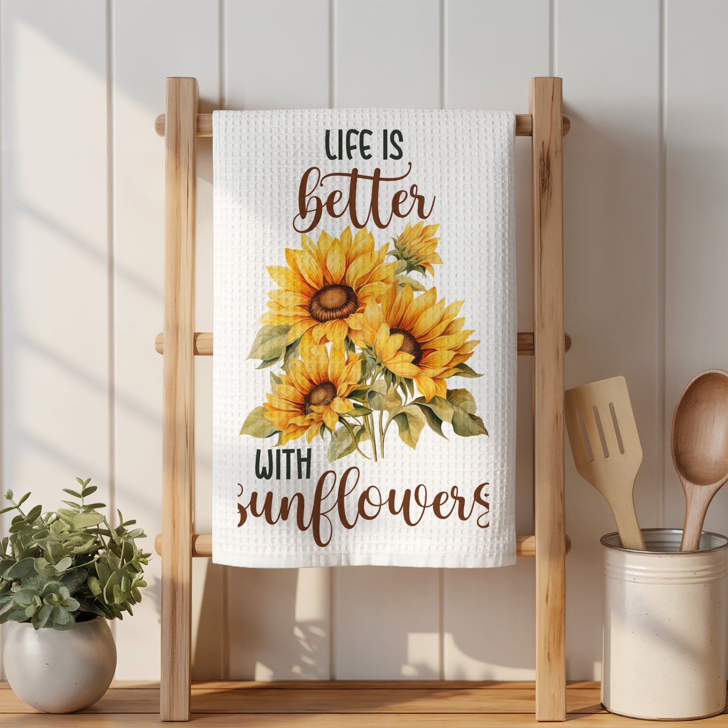 Kitchen towel with sunflowers and "Life is better with sunflowers" text.