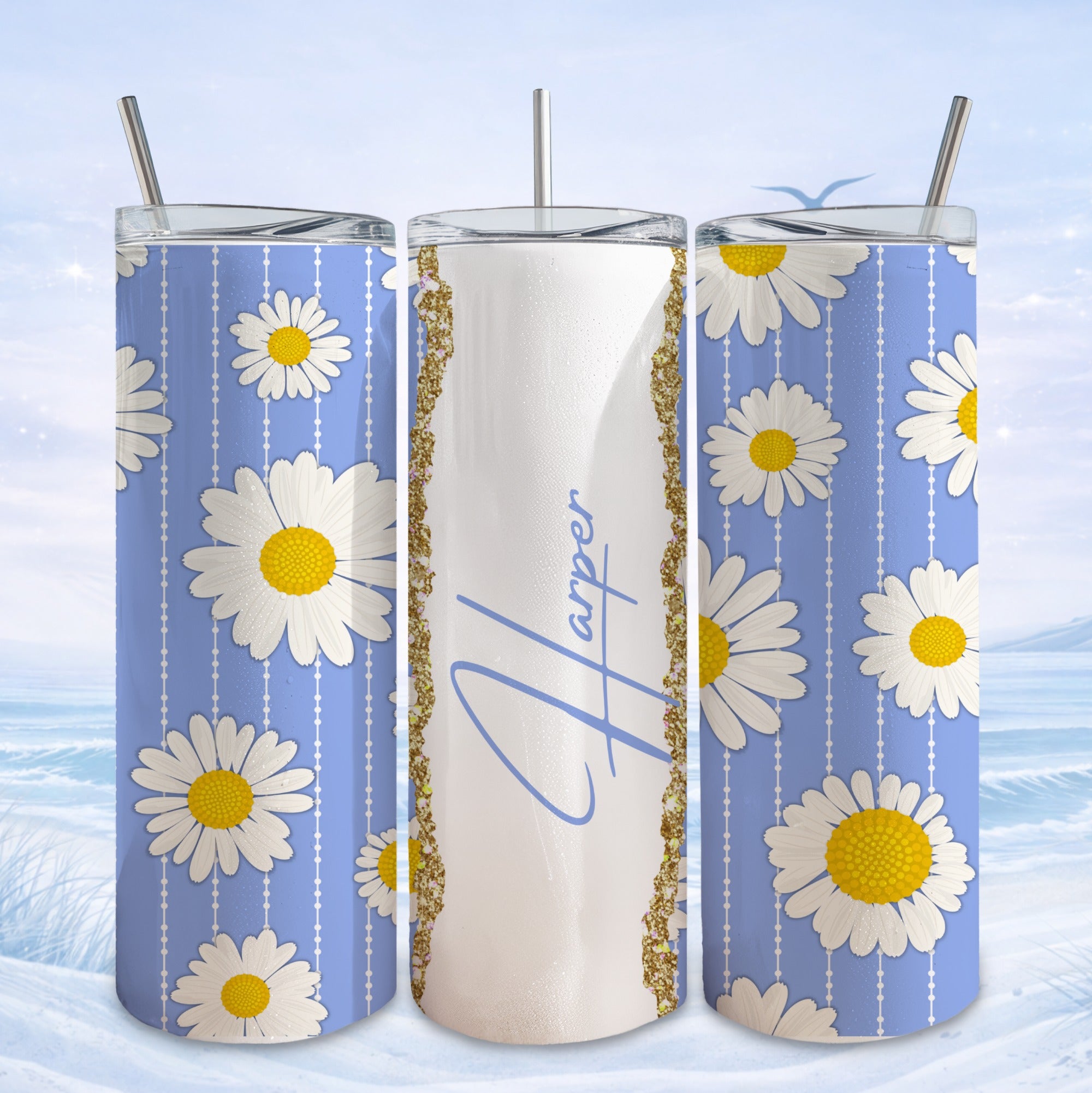 Three tumblers with blue background and white daisies, one centered with "Harper" in script.