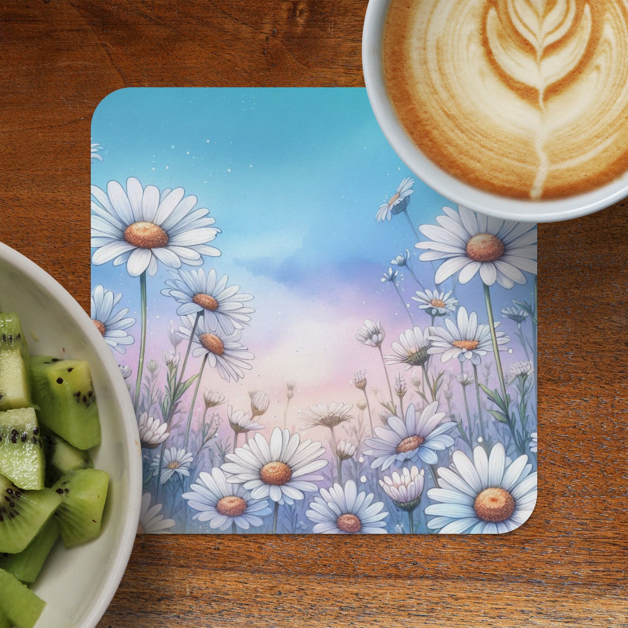 White daisies bloom in a watercolor sky, next to coffee and kiwi.