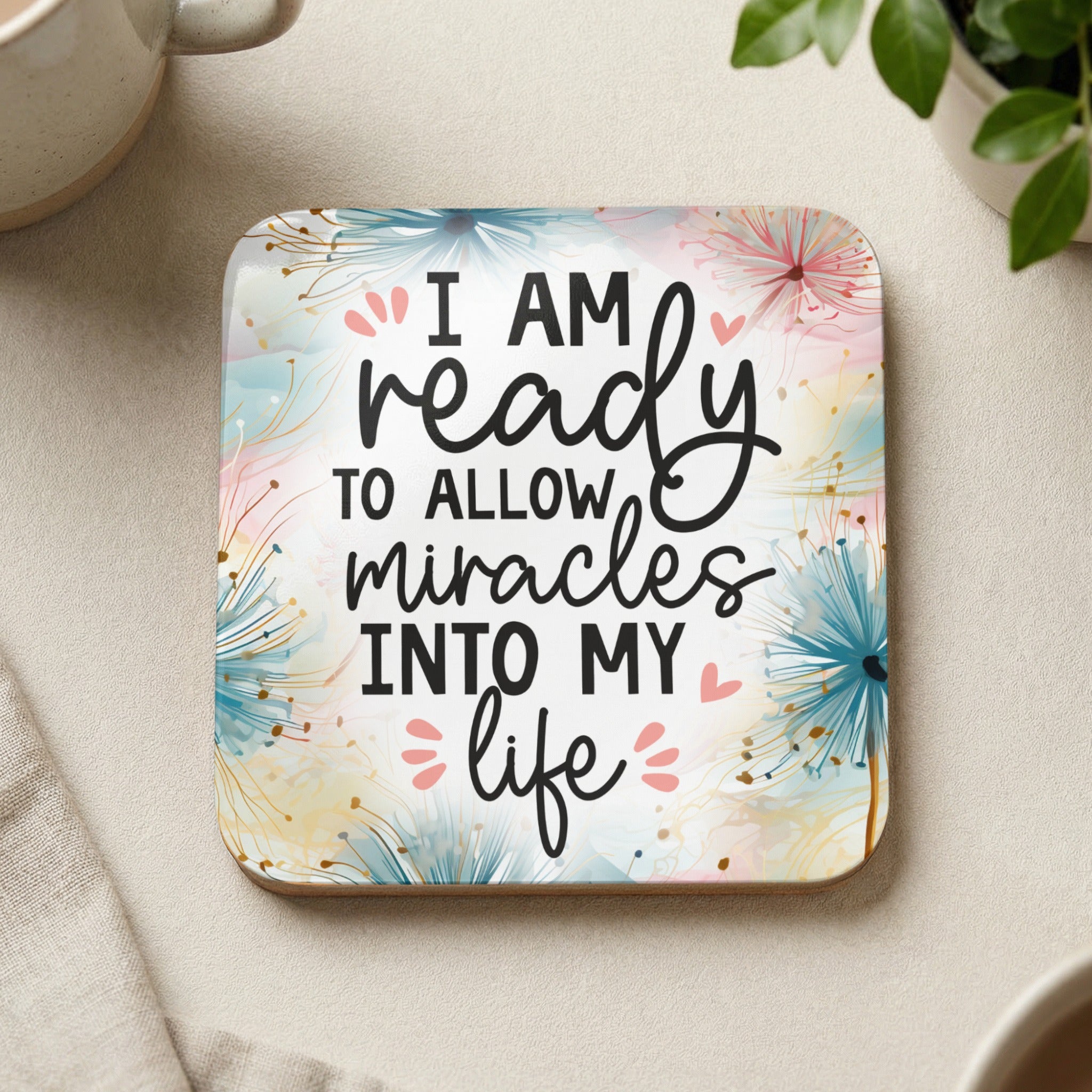 Coaster with text "I am ready to allow miracles into my life" and floral design.