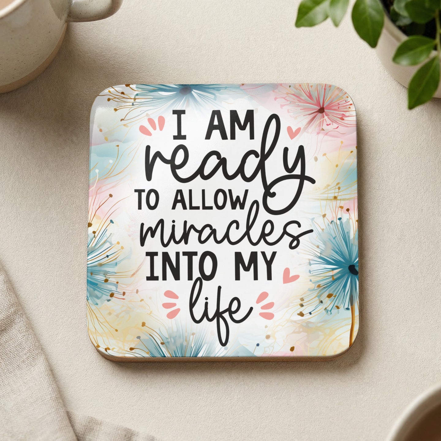 Coaster with text "I am ready to allow miracles into my life" and floral design.