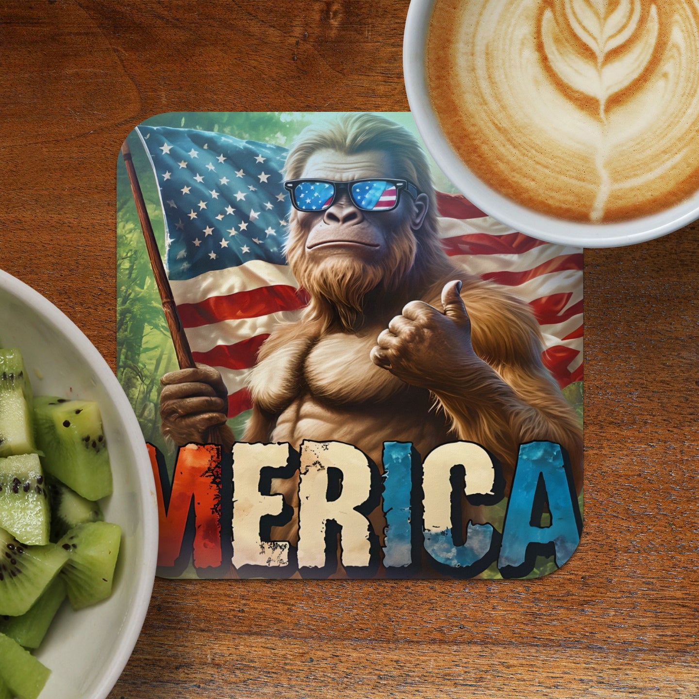 Bigfoot in sunglasses with American flag and "MERICA" text, thumbs up.