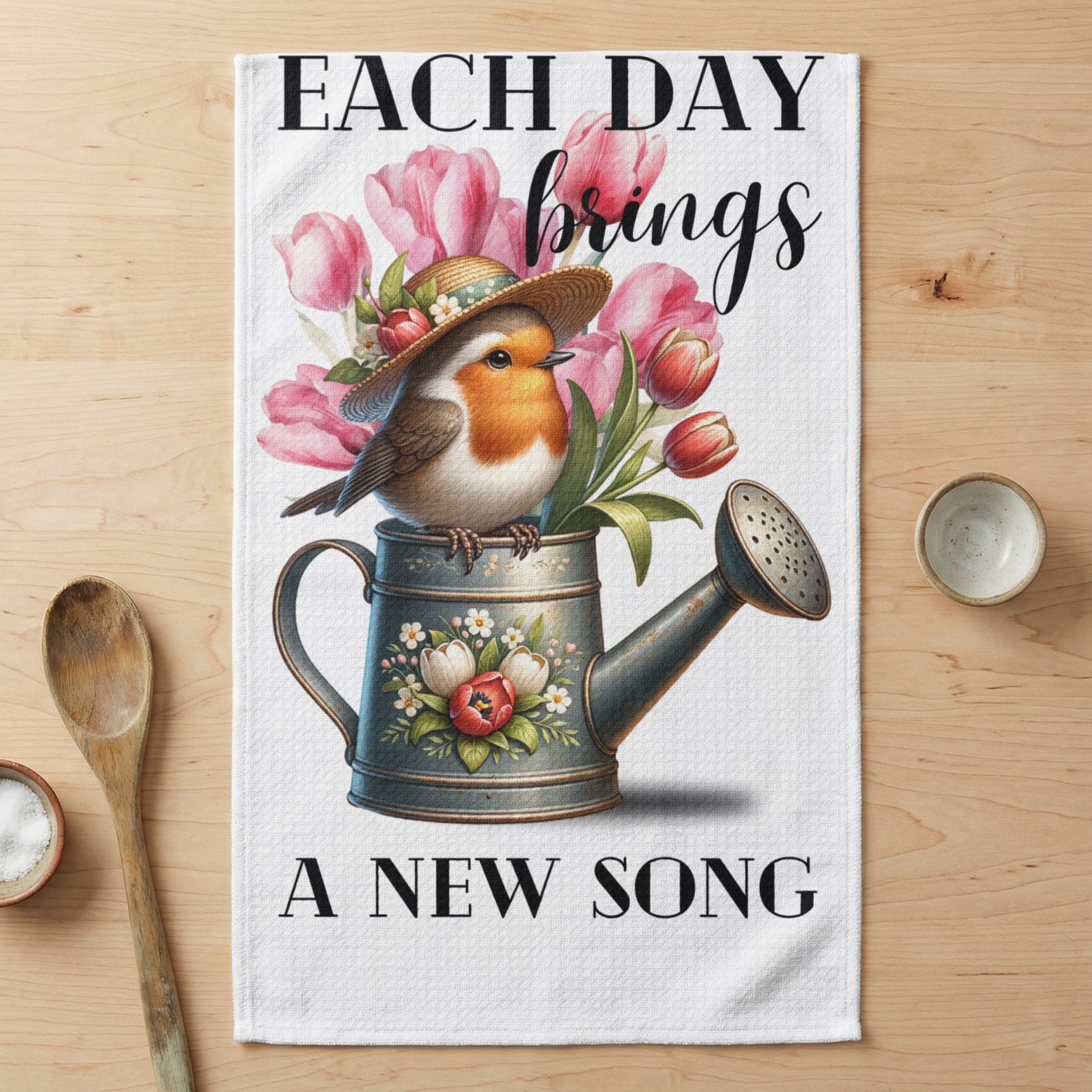 Robin in watering can with tulips and inspirational text.