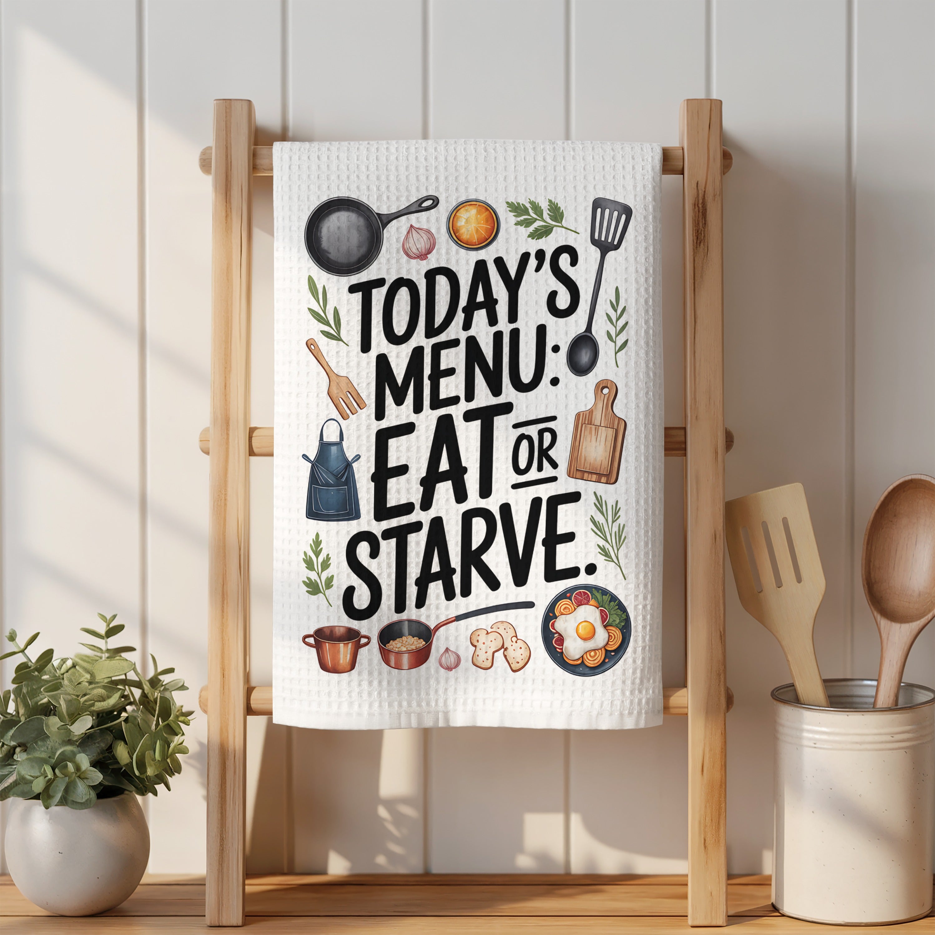 Kitchen towel with "Today's Menu: Eat or Starve" text and illustrations.