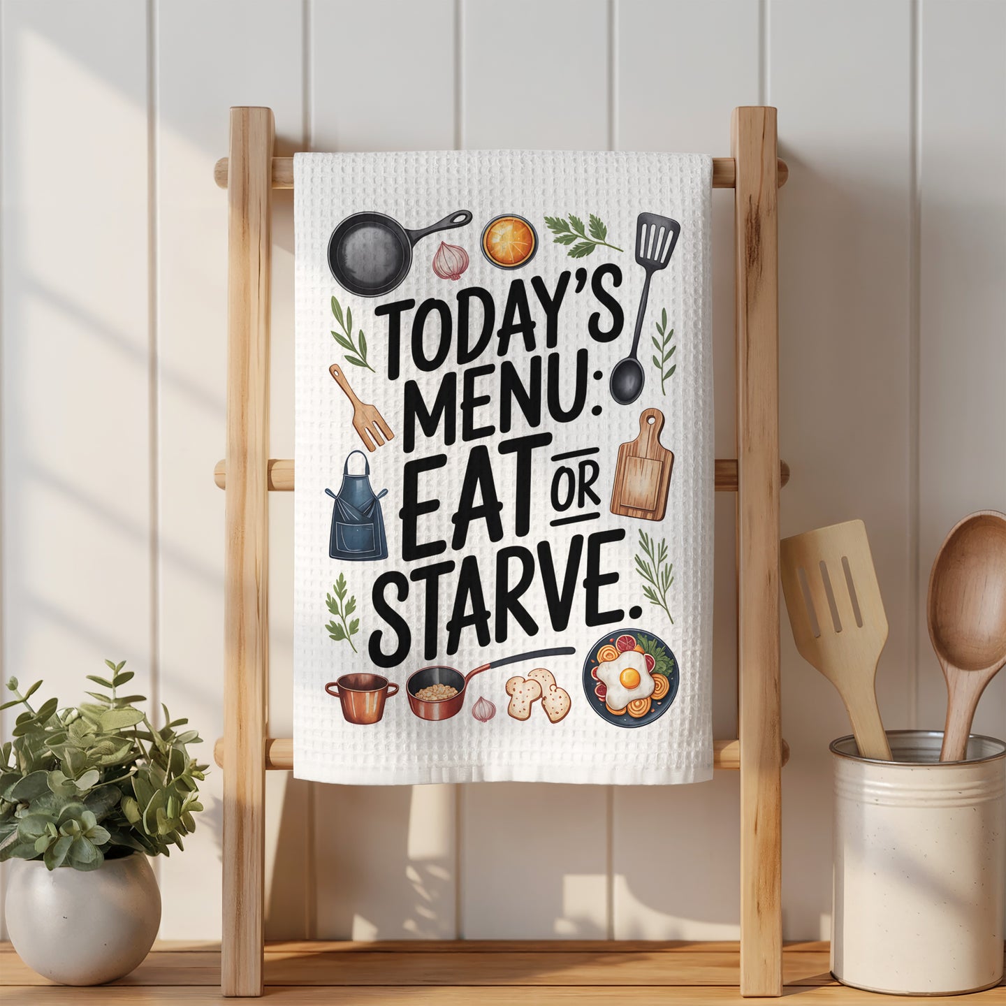Kitchen towel with "Today's Menu: Eat or Starve" text and illustrations.