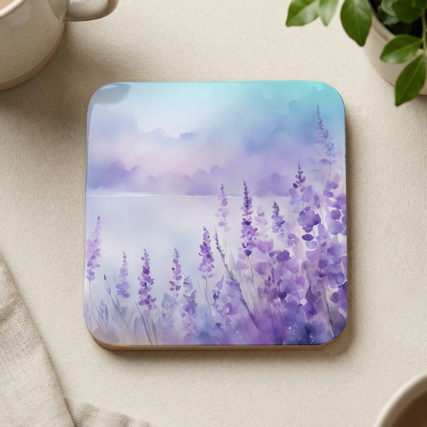Watercolor lavender field with soft sky and a cup.