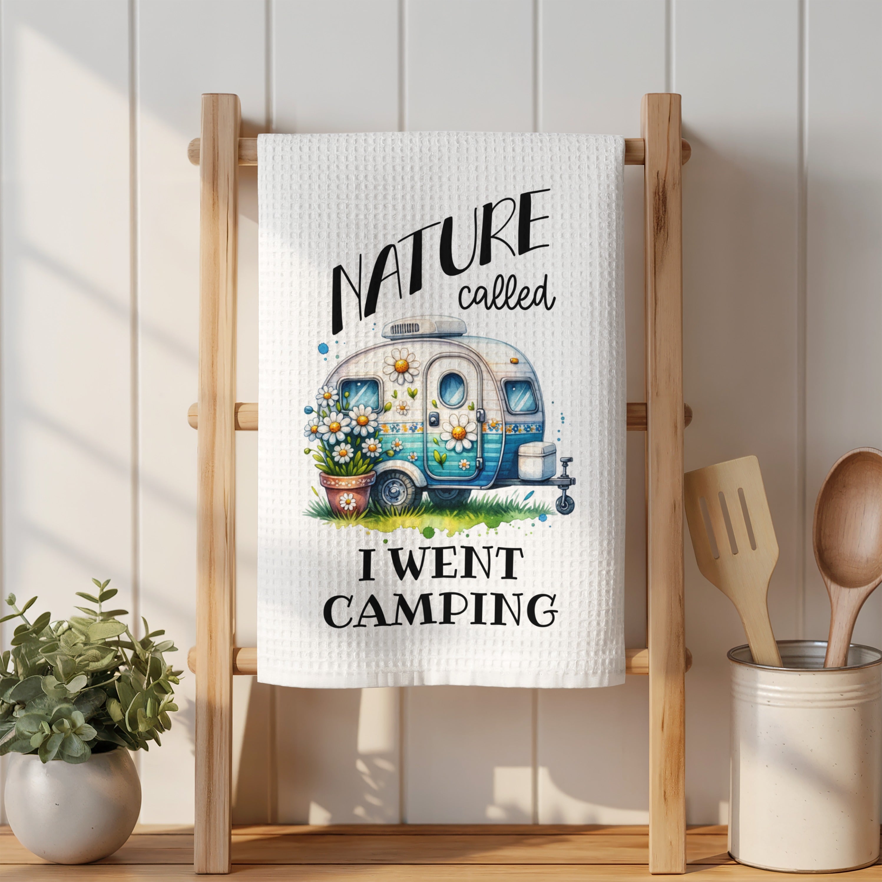 White towel with "Nature called, I went camping" and a camper illustration.