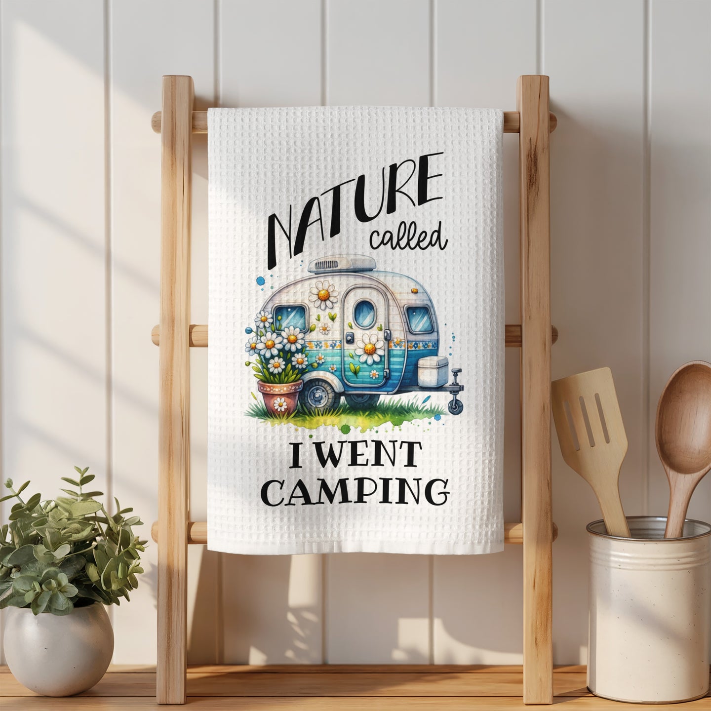 White towel with "Nature called, I went camping" and a camper illustration.
