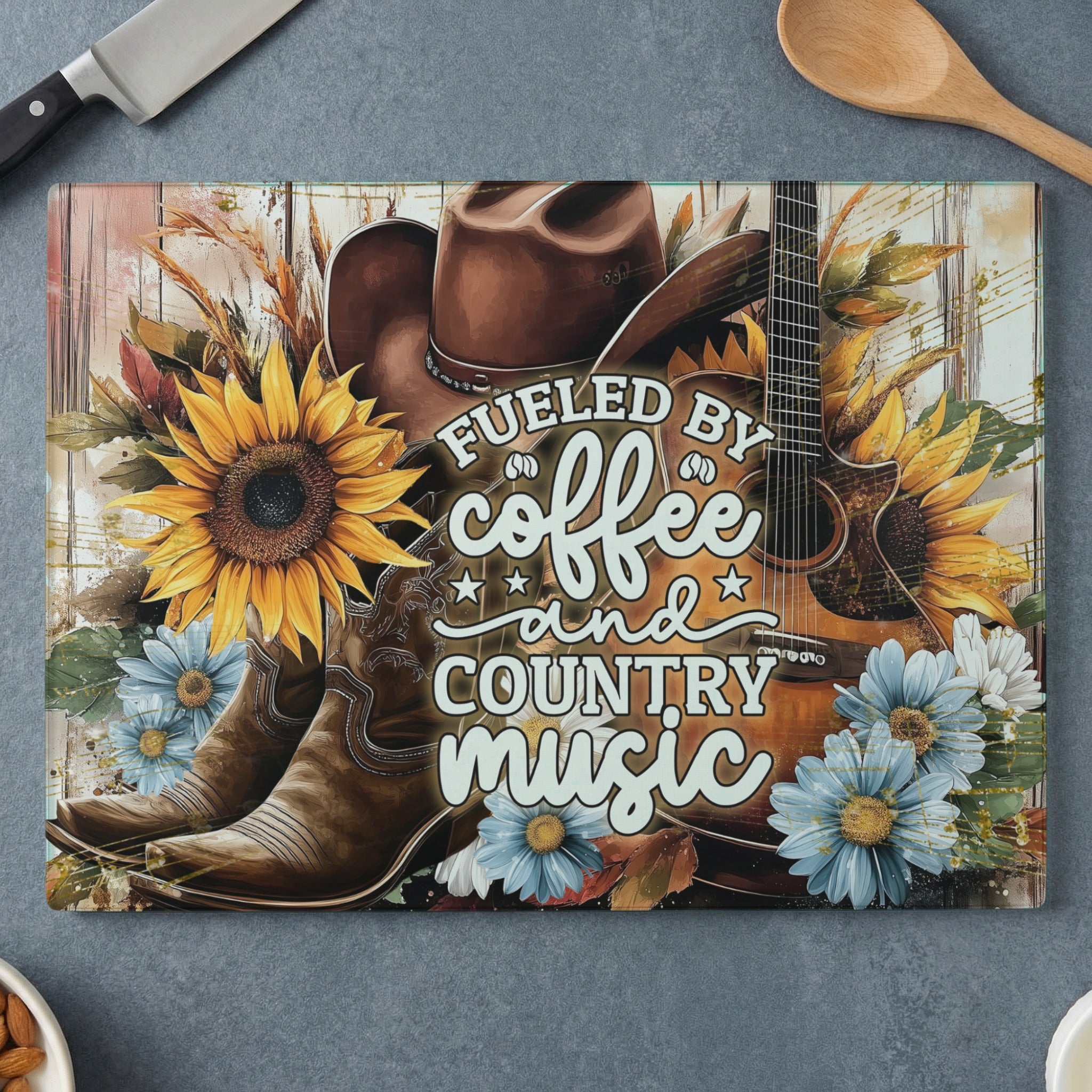 Cowboy boots, hat, and guitar with sunflowers and text "Fueled by coffee and country music".
