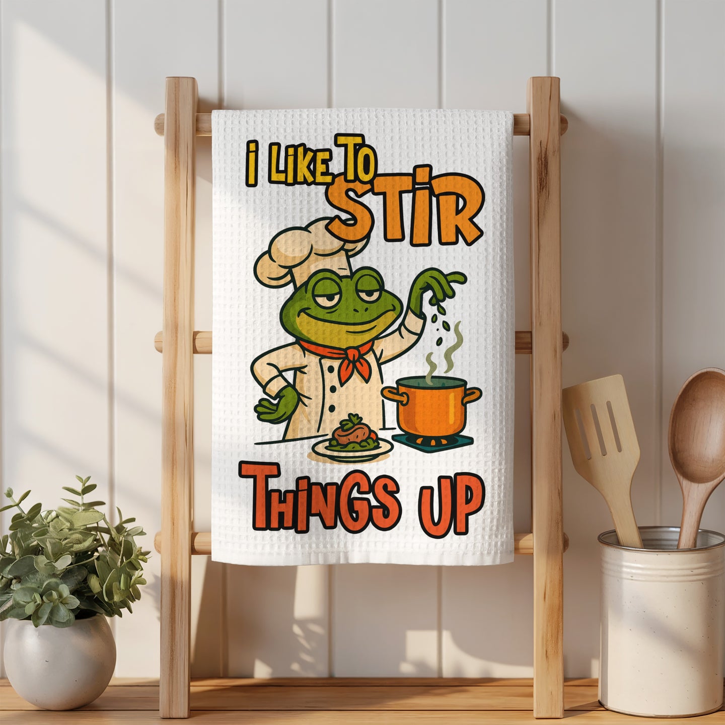 Frog chef in hat with pot, text "I like to stir things up."