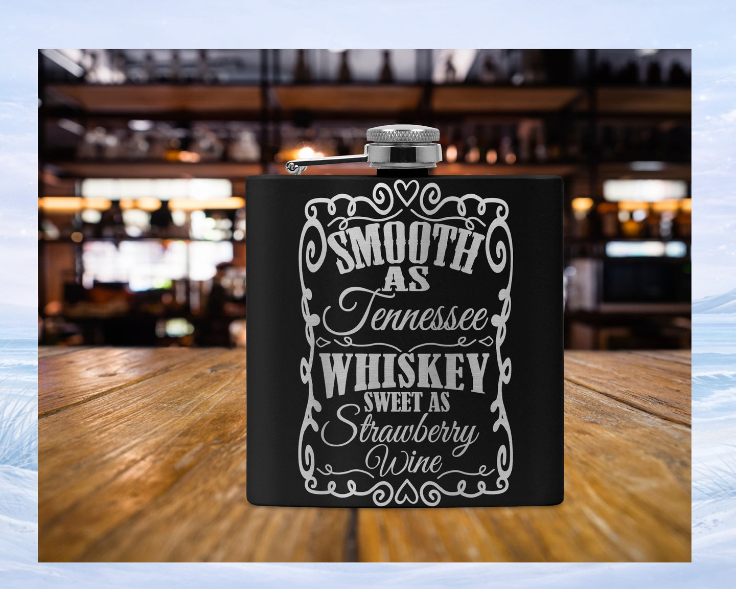 Black flask with "Smooth as Tennessee Sweet as Strawberry Wine" text.