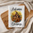 White kitchen towel with "Autumn Blessings" and a bird on a birdhouse surrounded by sunflowers.