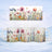 Mug with watercolor floral pattern on snowy background.