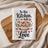 Kitchen towel with "In this Kitchen, we bake with Love" and heart-shaped cookies.