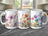 Three white mugs display floral watercolor designs with purple, pink, orange, and blue flowers.