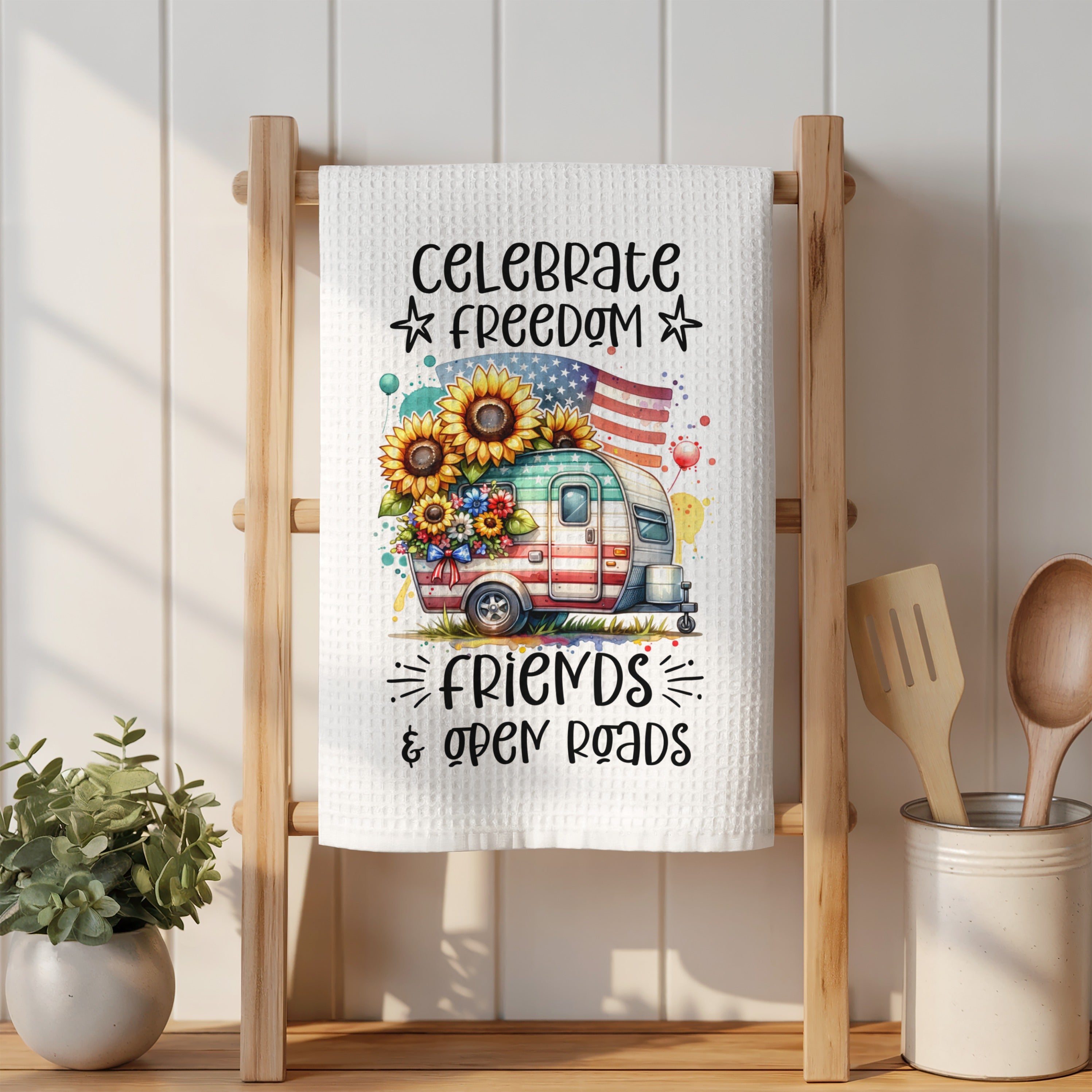 Towel with watercolor camper, sunflowers, and text "Celebrate Freedom, Friends & Open Roads".