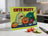Cute Party glass cutting board with cartoon vegetables and text.