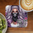 Woman with skull mask and purple hair, text "Who runs the world?".