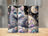 Whimsical cat with blue eyes and swirling celestial patterns on three tumblers.