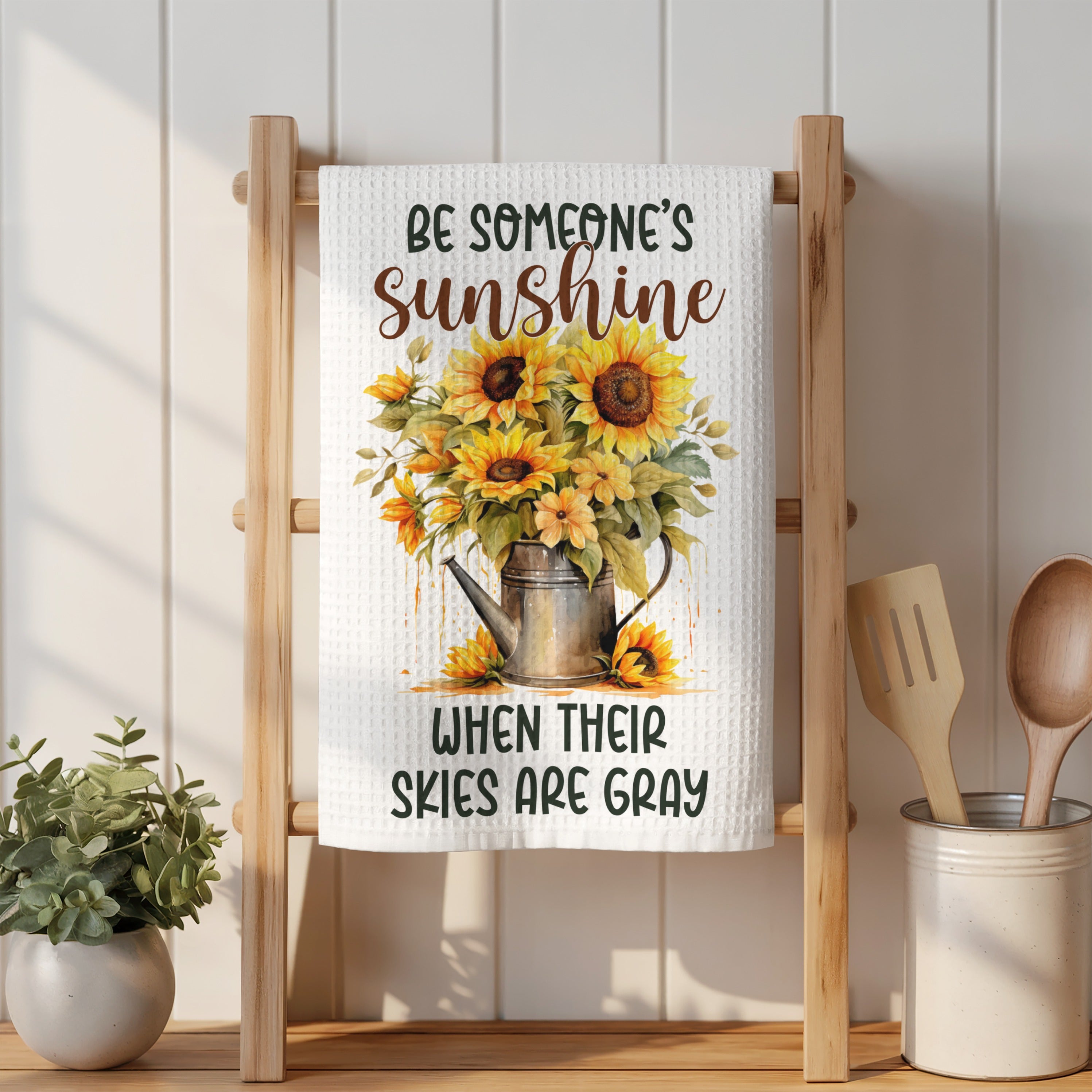 Tea towel with sunflowers and text "be someone's sunshine when their skies are gray".