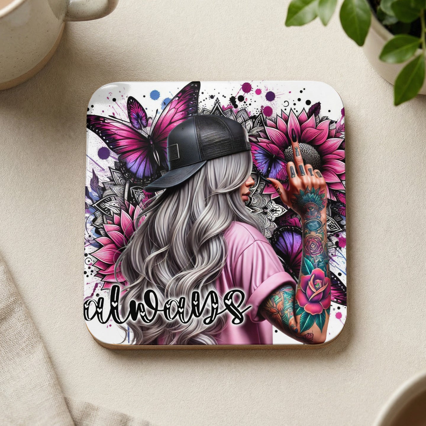 Woman with tattoos, pink flowers, and butterflies, holding up a middle finger, text "always".