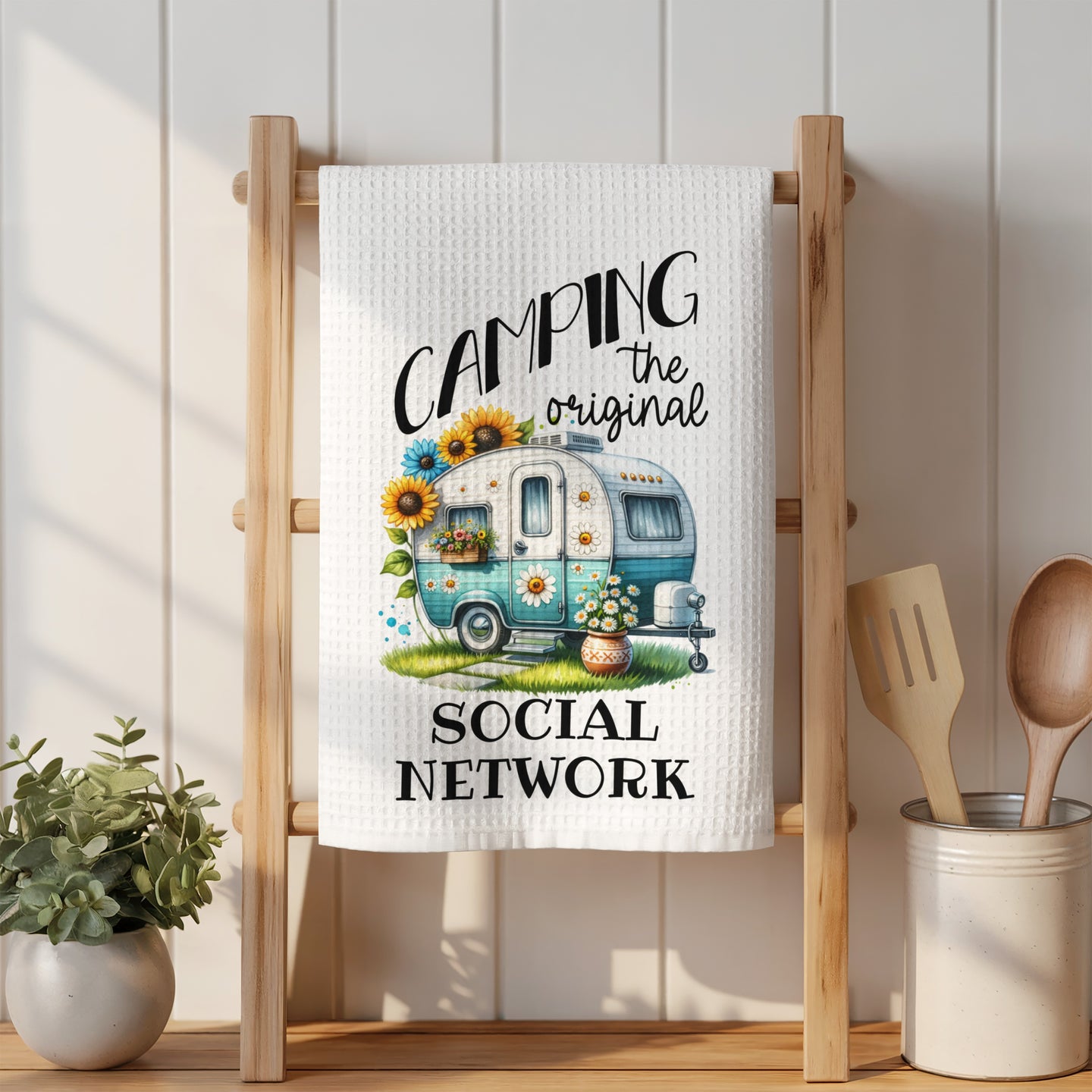 Camping the original social network with a camper and sunflowers.