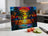Colorful stained glass sunset with palm trees on a cutting board.