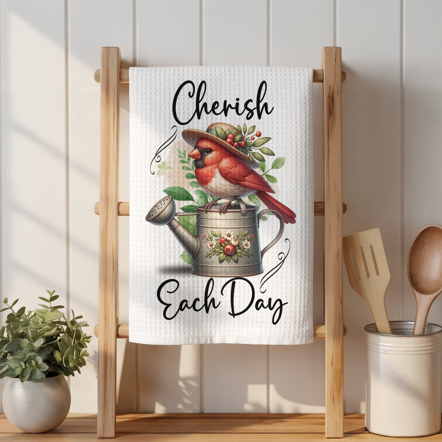 Cardinal with berries and flowers on watering can, text "Cherish Each Day".