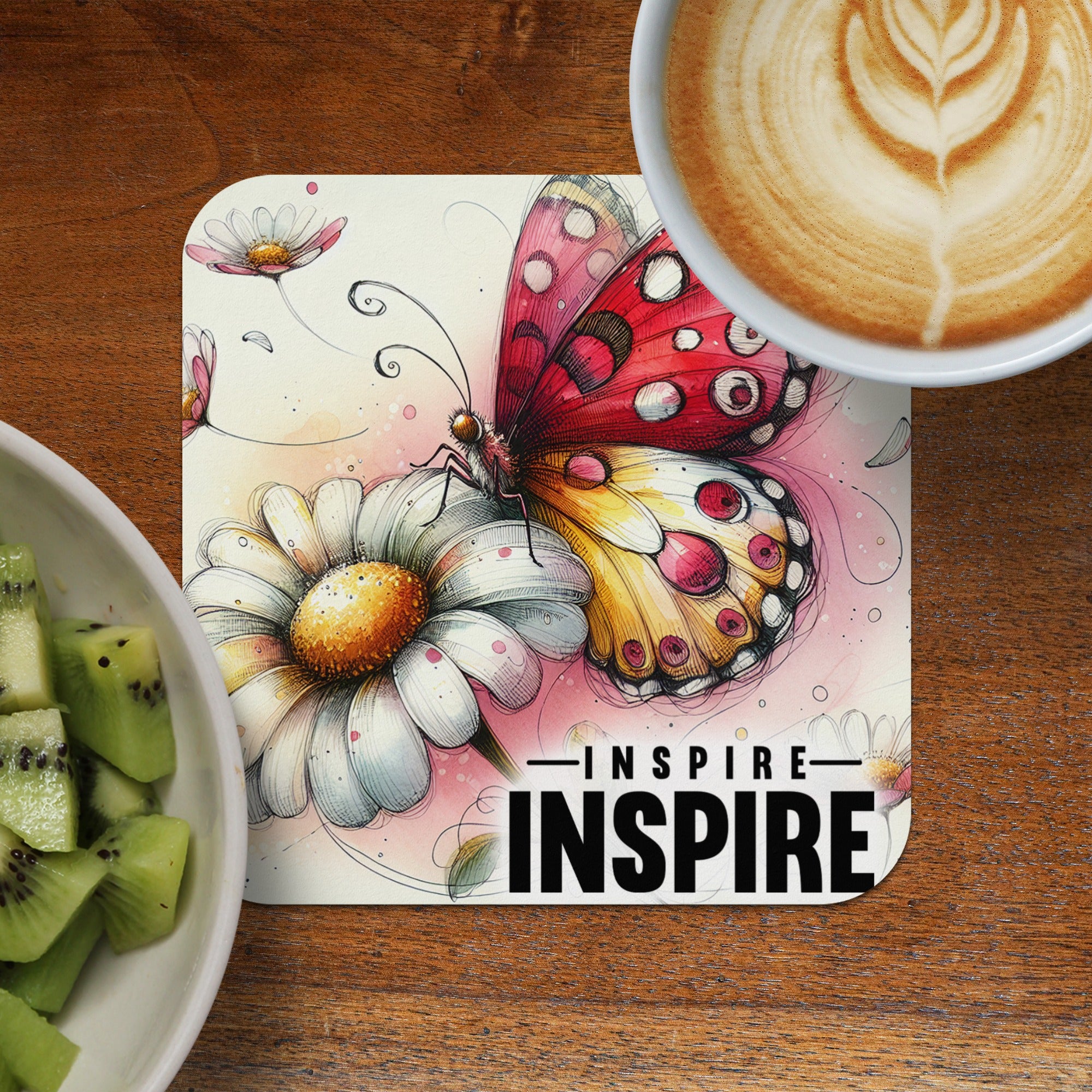 Butterfly on daisy with text "INSPIRE INSPIRE" and cup of coffee.