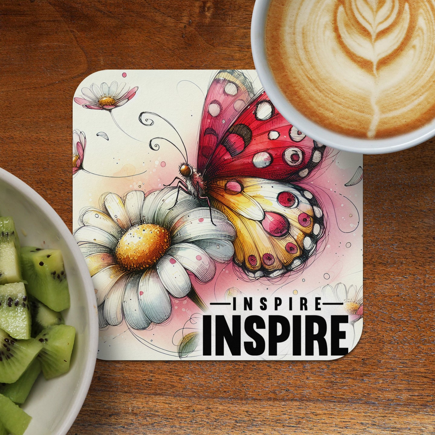 Butterfly on daisy with text "INSPIRE INSPIRE" and cup of coffee.