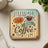Coaster with "LESS TALK MORE COFFEE" text and coffee bean graphic.