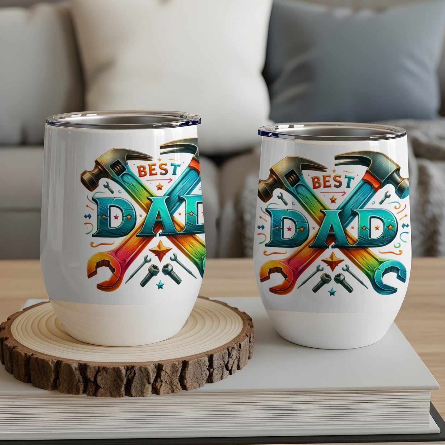 Two insulated tumblers with "BEST DAD" text surrounded by tools.