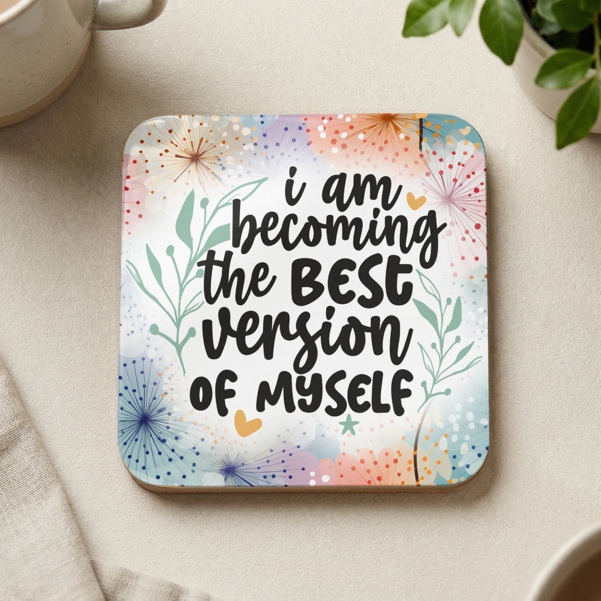 Coaster with "i am becoming the BEST version of myself" in colorful floral print.