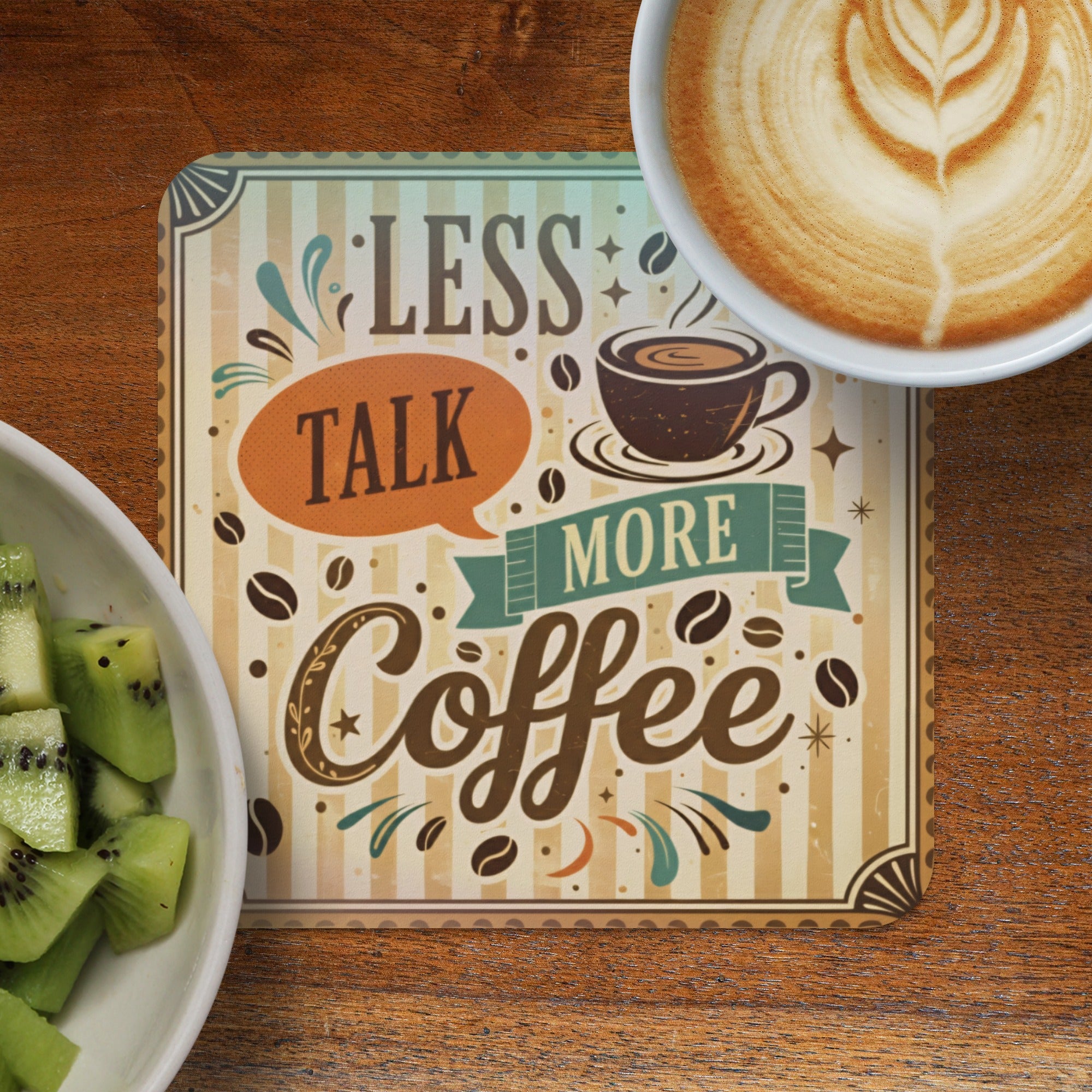 Coaster with "Less Talk More Coffee" text and latte art coffee.